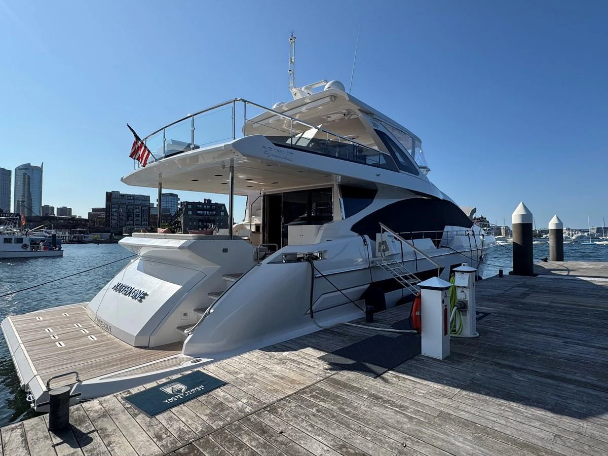 A luxurious yacht docked at a marina, showcasing its sleek design and spacious decks. aboard 2022 AZIMUT GRANDE 25M Yacht for Sale