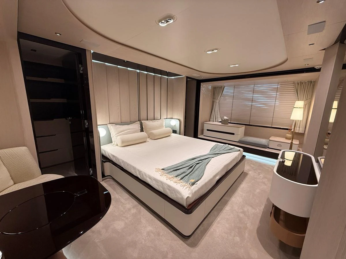 The master stateroom offers a spacious and luxurious sleeping area with elegant furnishings and soft lighting. aboard 2022 AZIMUT GRANDE 25M Yacht for Sale