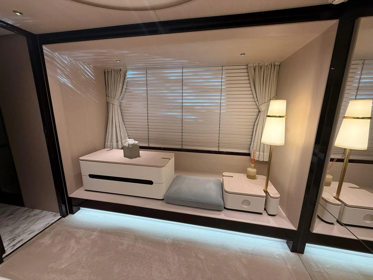 A cozy stateroom with elegant furnishings and soft lighting. aboard 2022 AZIMUT GRANDE 25M Yacht for Sale