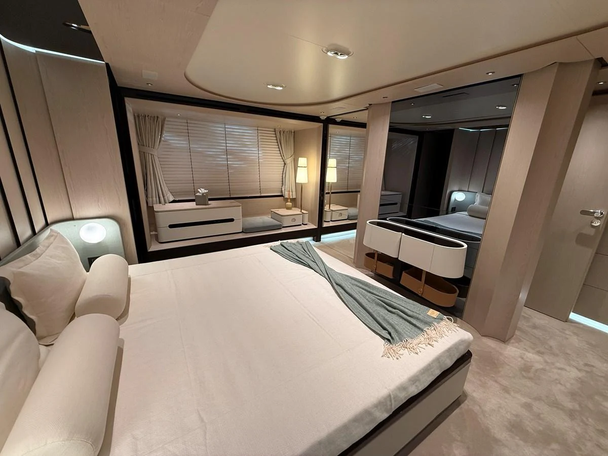 A luxurious stateroom featuring a comfortable bed and elegant furnishings. aboard 2022 AZIMUT GRANDE 25M Yacht for Sale