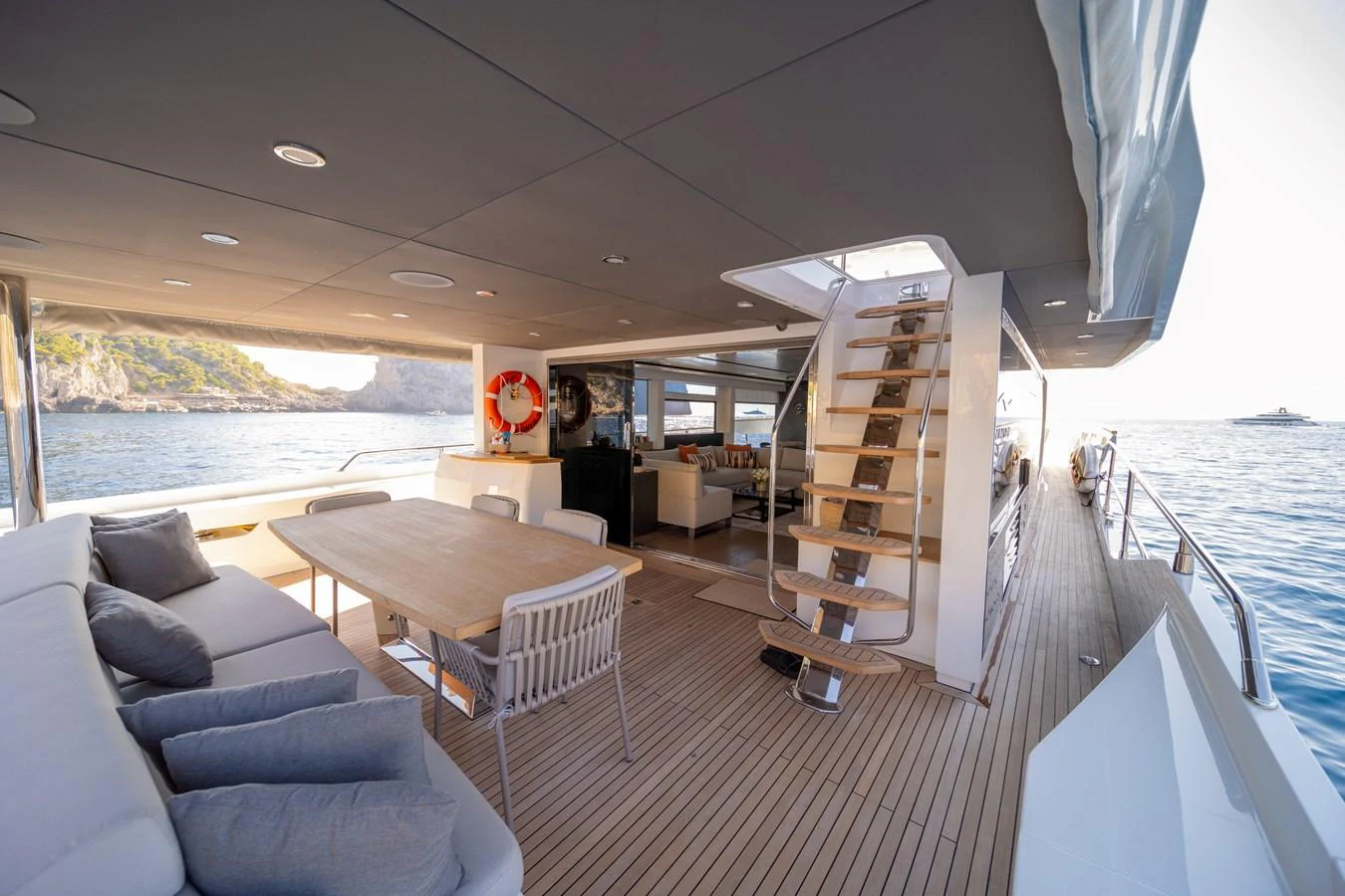The aft deck offers a spacious and comfortable area for dining and relaxation with stunning views of the surrounding waters. aboard KAMOKA Yacht for Sale