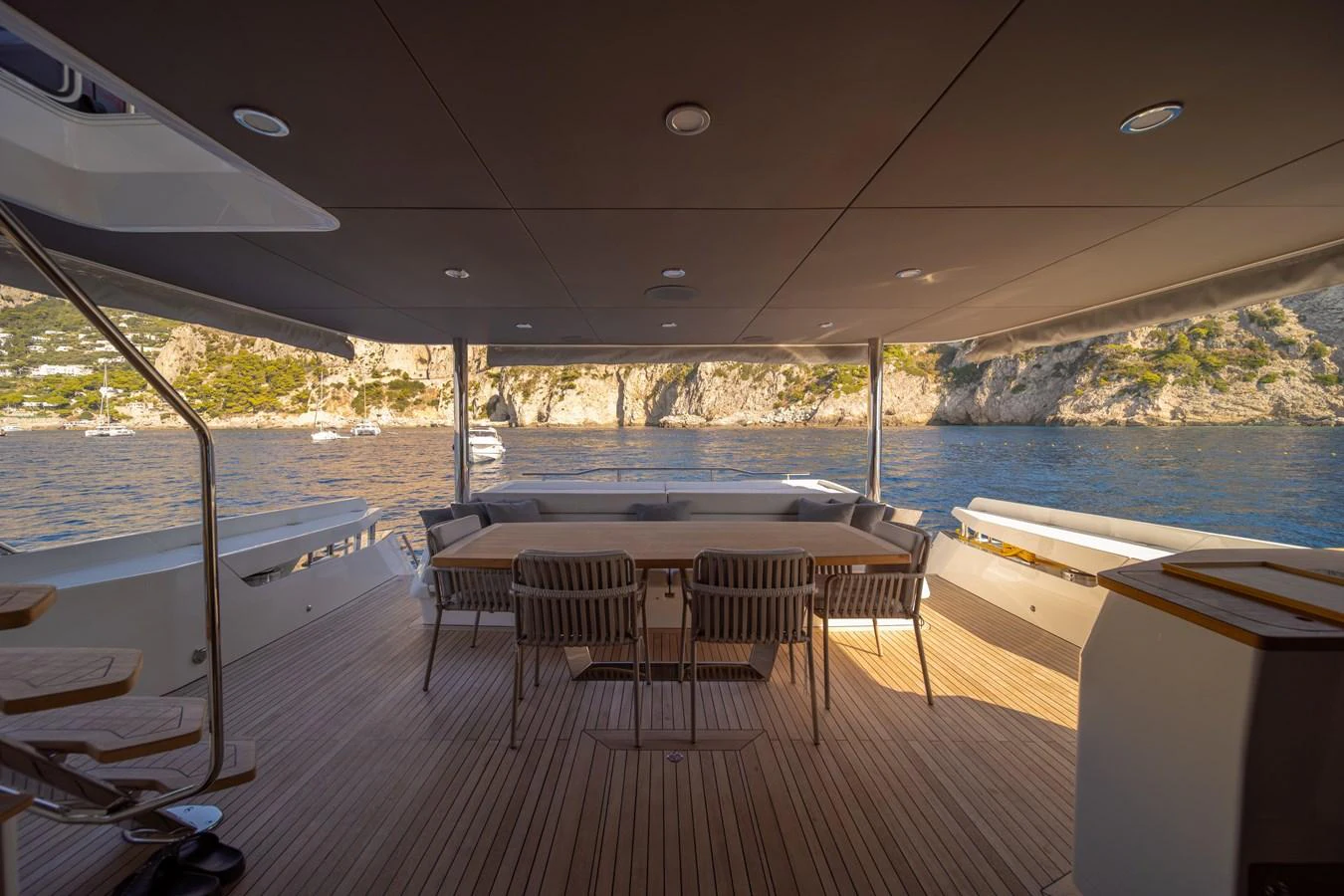 The aft deck offers a spacious and shaded area with comfortable seating and stunning views of the surrounding waters. aboard KAMOKA Yacht for Sale