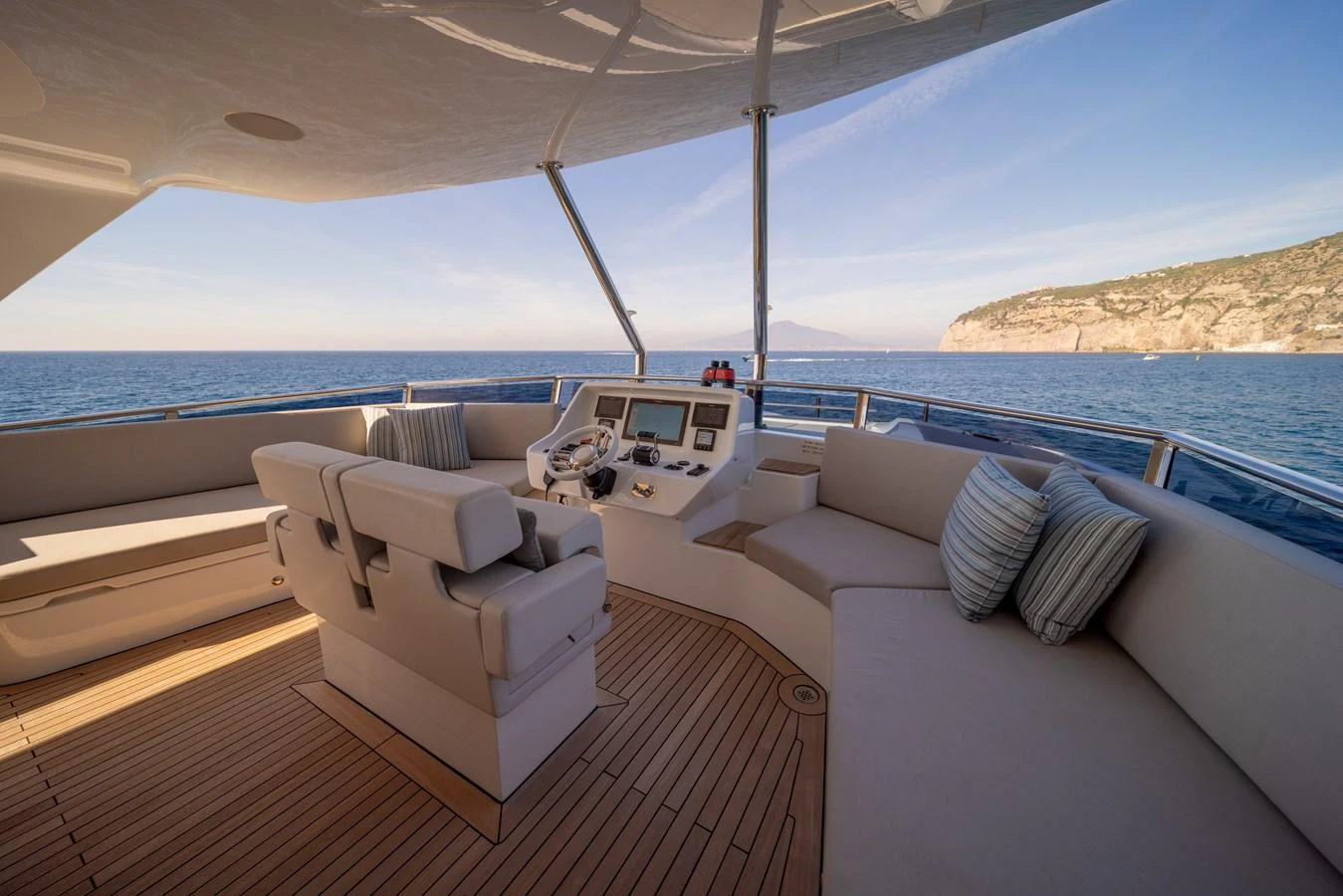 The helm area features plush seating and state-of-the-art navigation equipment, offering a perfect blend of comfort and functionality. aboard KAMOKA Yacht for Sale