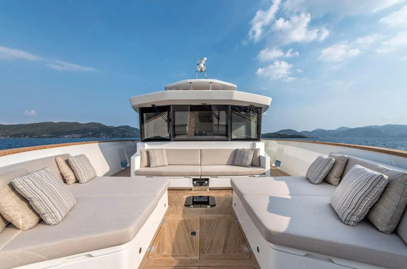The foredeck features spacious sun pads and comfortable seating with scenic views. aboard KAMOKA Yacht for Sale