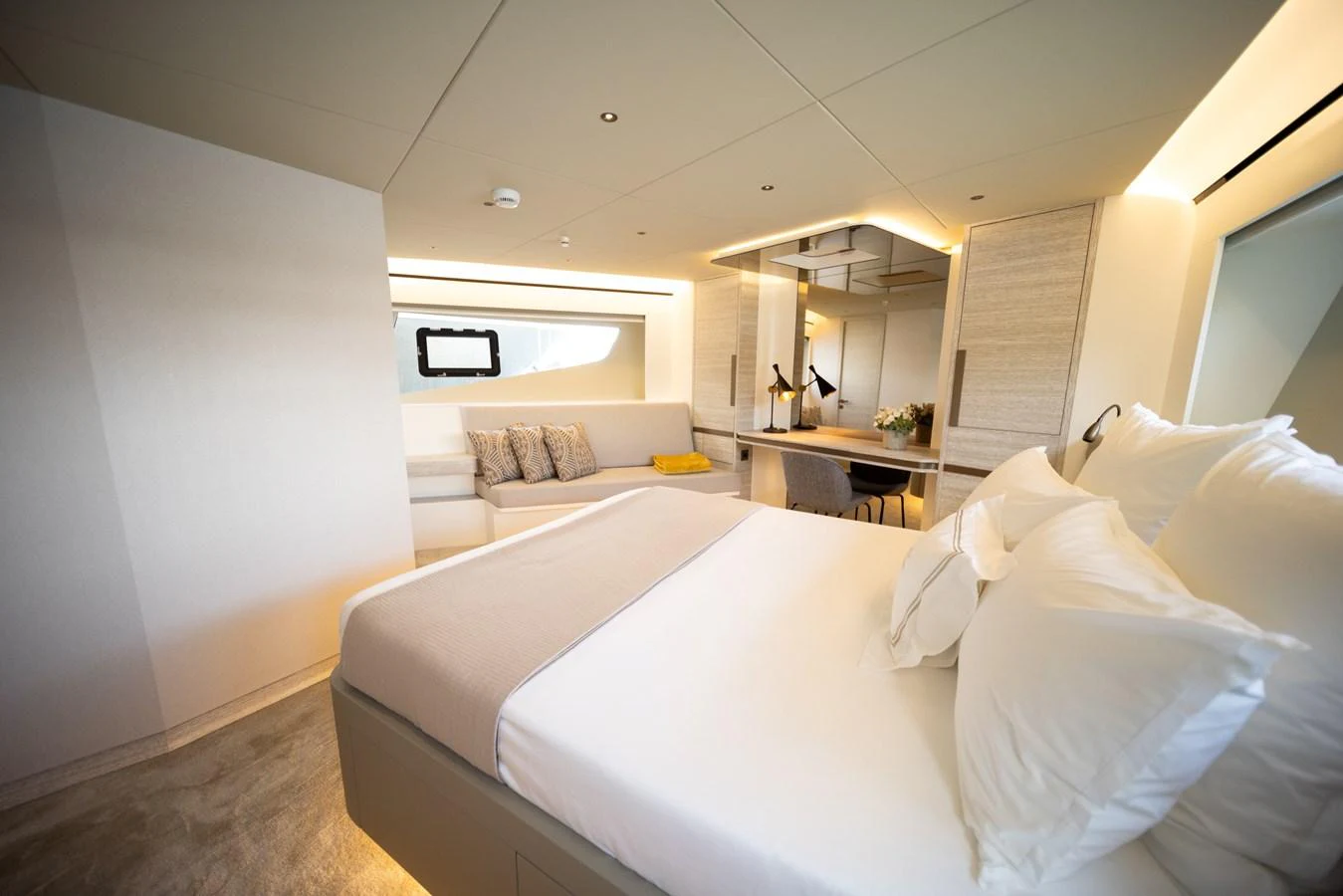 The stateroom offers a luxurious and serene retreat with plush bedding and modern decor. aboard KAMOKA Yacht for Sale