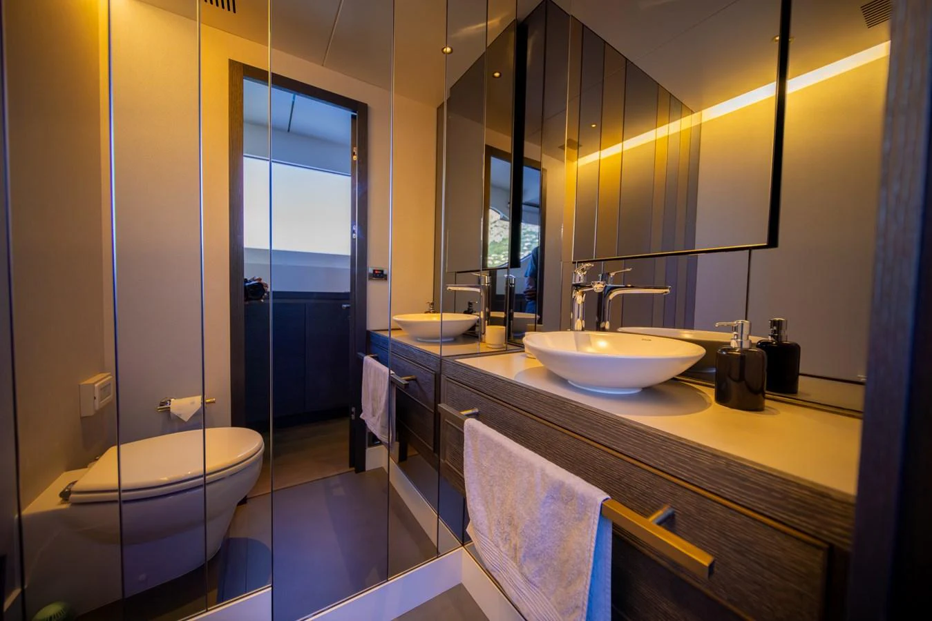 This modern yacht bathroom features sleek fixtures and a stylish design. aboard KAMOKA Yacht for Sale