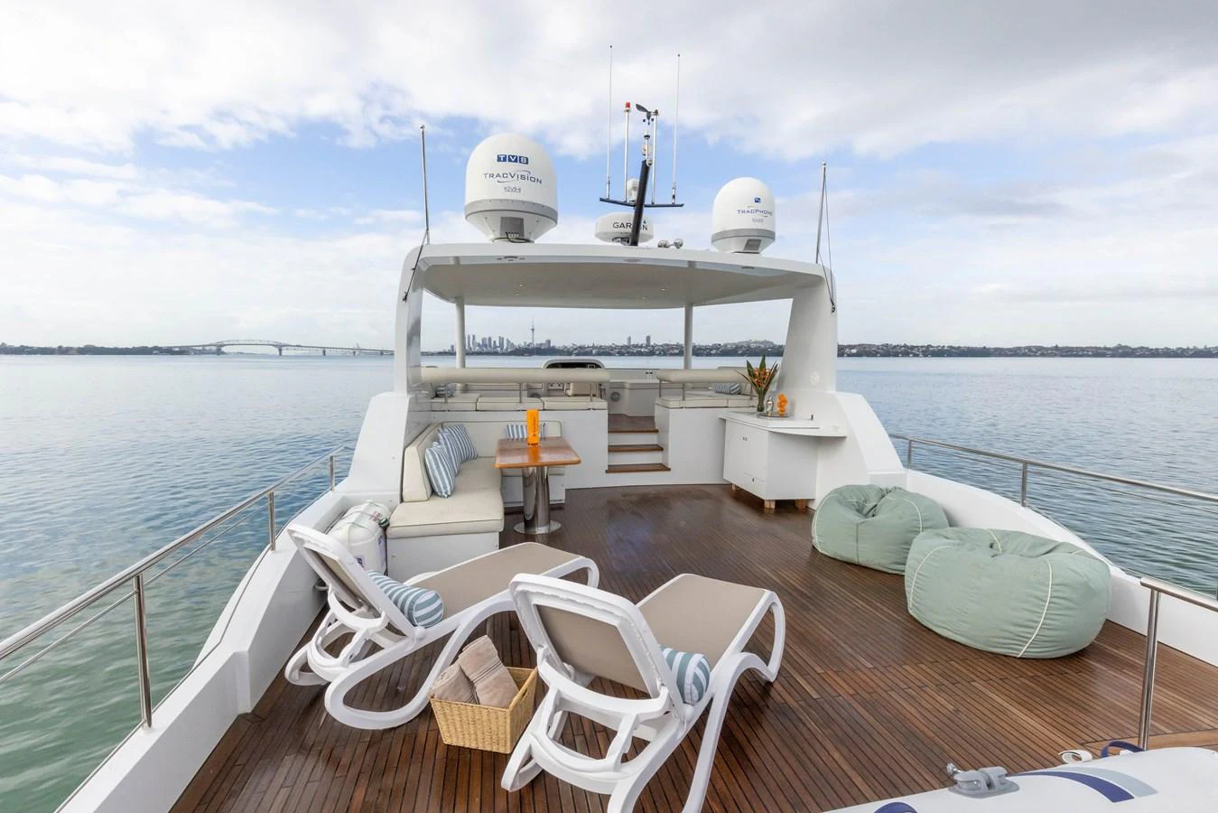 The aft deck offers a spacious lounging area with comfortable seating and stunning views of the water. aboard DUTCHESS Yacht for Sale
