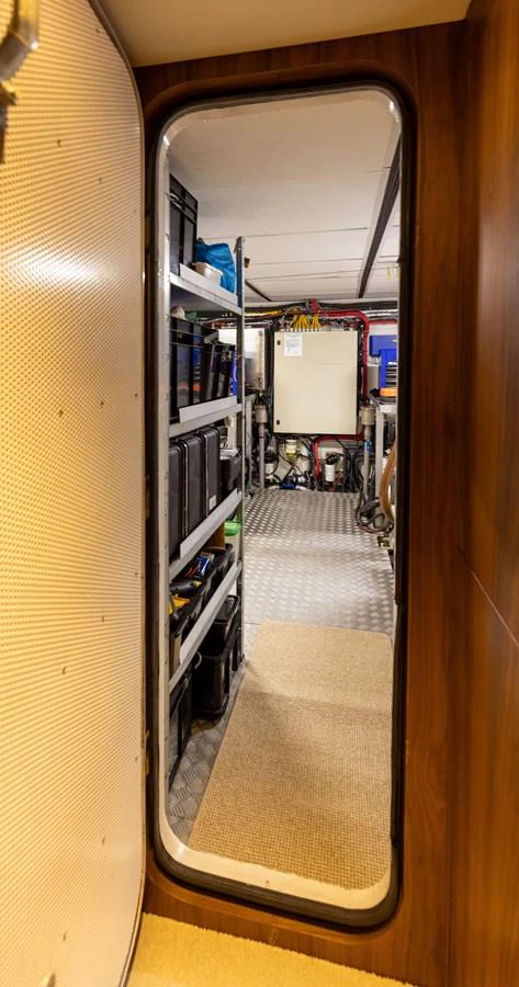 A view into the yacht's utility room, showcasing organized storage and equipment. aboard DUTCHESS Yacht for Sale