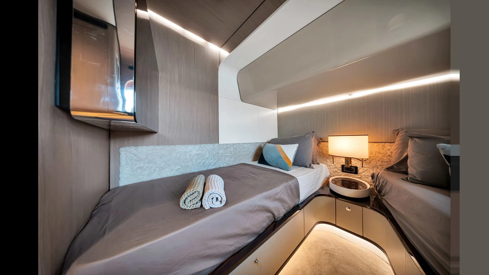 The guest cabin features cozy twin beds with modern lighting and elegant decor. aboard CLOUD 9 Yacht for Sale