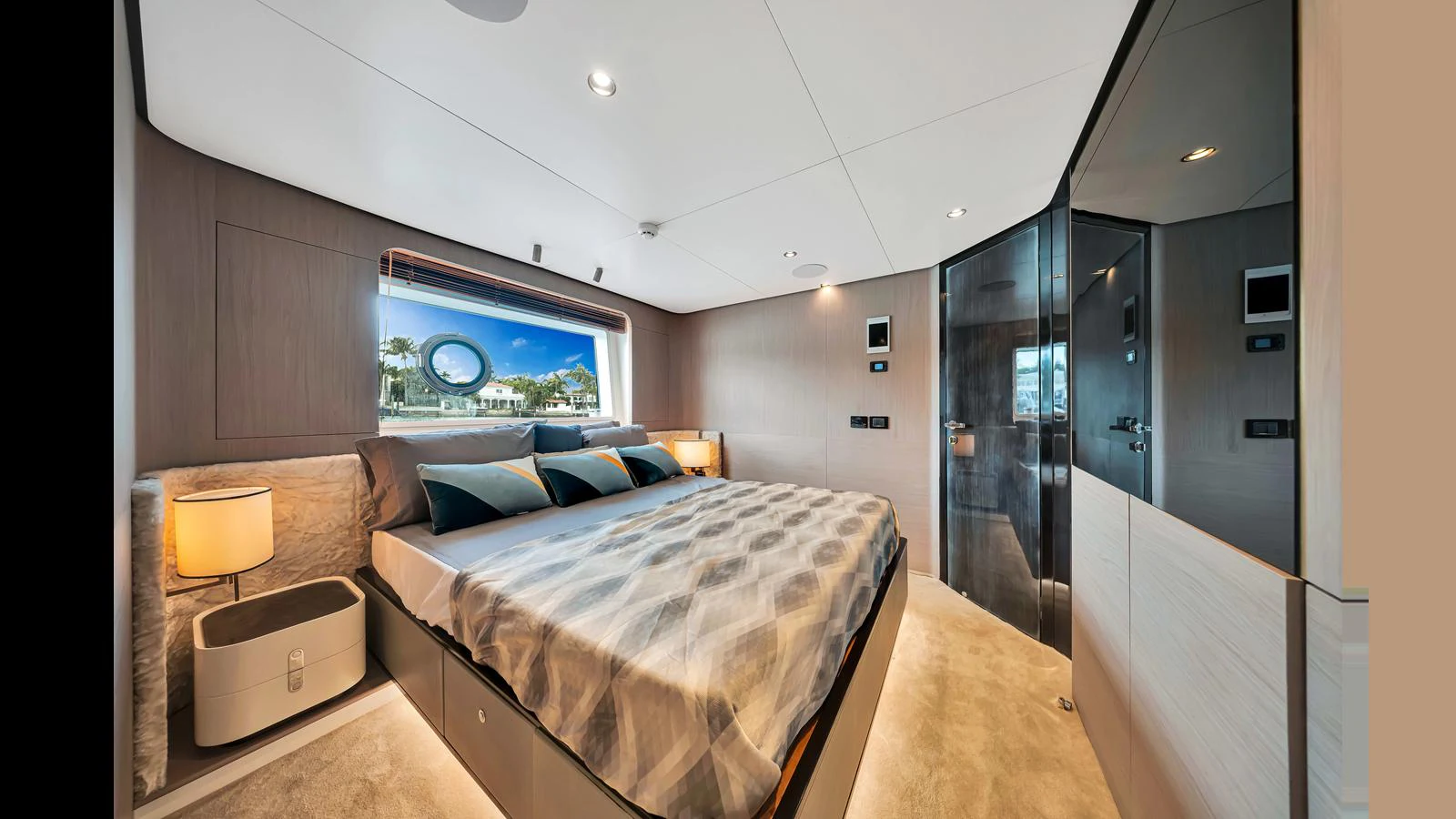 A luxurious stateroom featuring a large bed and modern decor. aboard CLOUD 9 Yacht for Sale