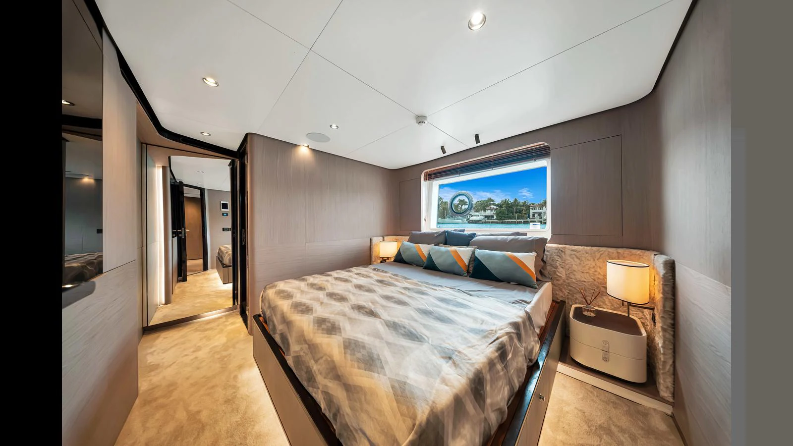 A luxurious stateroom with a large bed and modern decor. aboard CLOUD 9 Yacht for Sale
