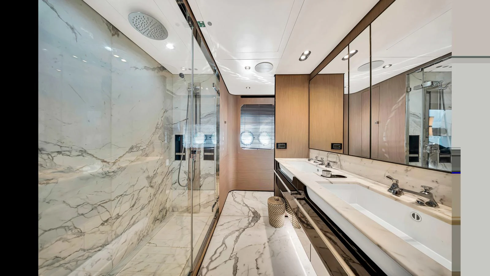 The yacht's bathroom features elegant marble surfaces and modern fixtures. aboard CLOUD 9 Yacht for Sale