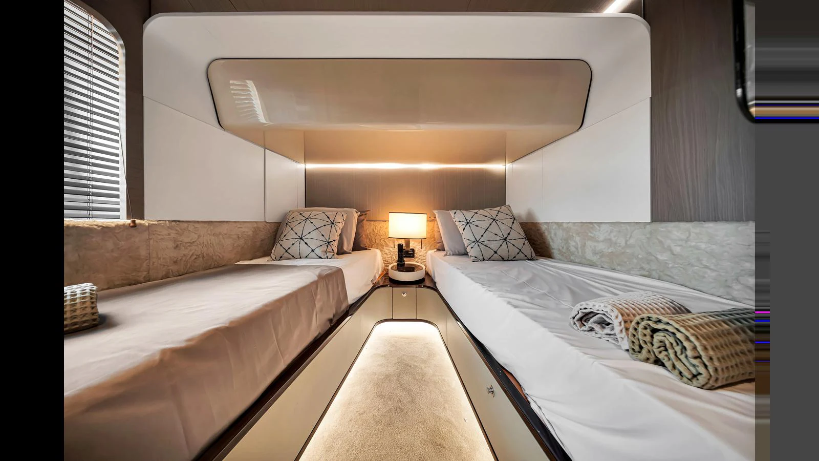The twin stateroom offers a cozy and modern sleeping area with two single beds and elegant lighting. aboard CLOUD 9 Yacht for Sale