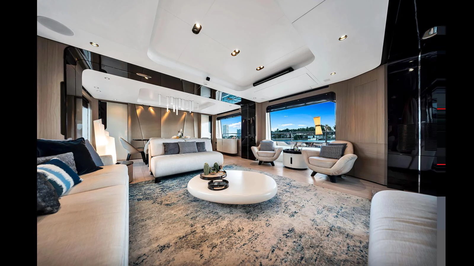 The yacht's salon features luxurious seating and a modern design with large windows offering stunning views. aboard CLOUD 9 Yacht for Sale