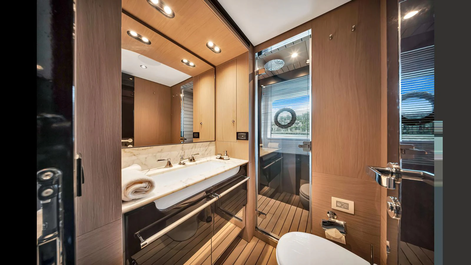 The yacht's bathroom features modern fixtures and a sleek design with ample lighting. aboard CLOUD 9 Yacht for Sale