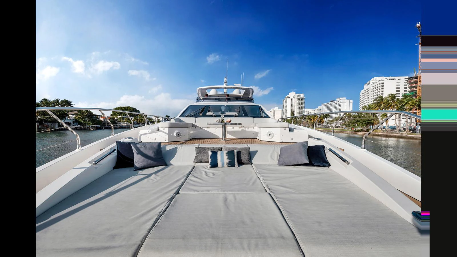 The foredeck features a spacious sunbathing area with plush cushions, perfect for relaxation. aboard CLOUD 9 Yacht for Sale