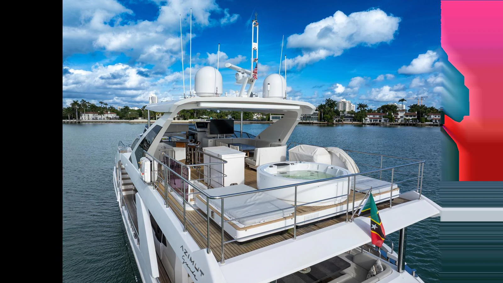 The yacht's aft deck features a luxurious hot tub and ample seating, perfect for relaxation and entertainment. aboard CLOUD 9 Yacht for Sale