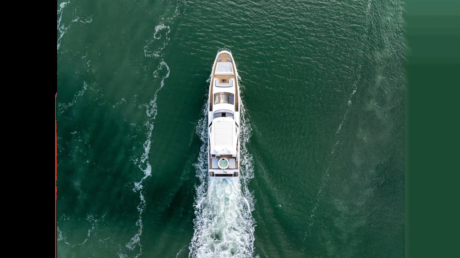 An overhead view of a yacht cruising through calm waters. aboard CLOUD 9 Yacht for Sale