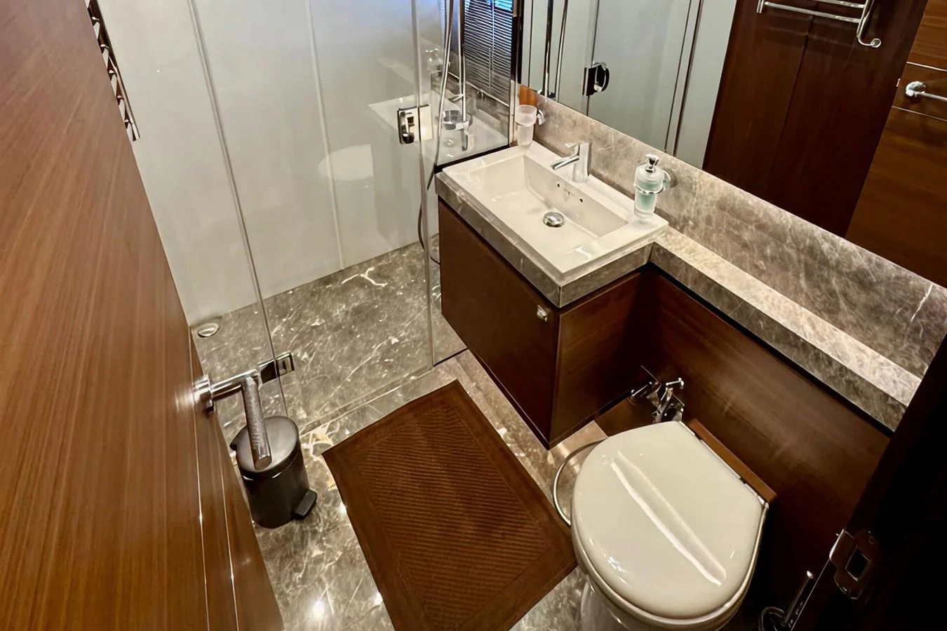 The yacht's bathroom features elegant marble flooring and modern fixtures. aboard LADY N Yacht for Sale