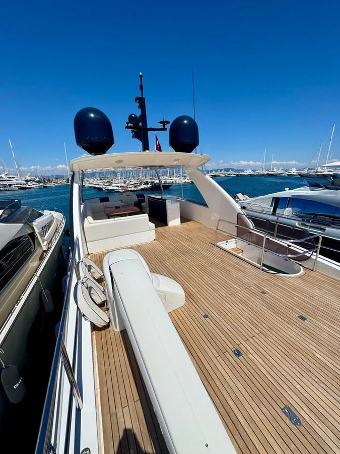 The flybridge offers ample space for relaxation and entertainment with a stunning view of the marina. aboard LADY N Yacht for Sale