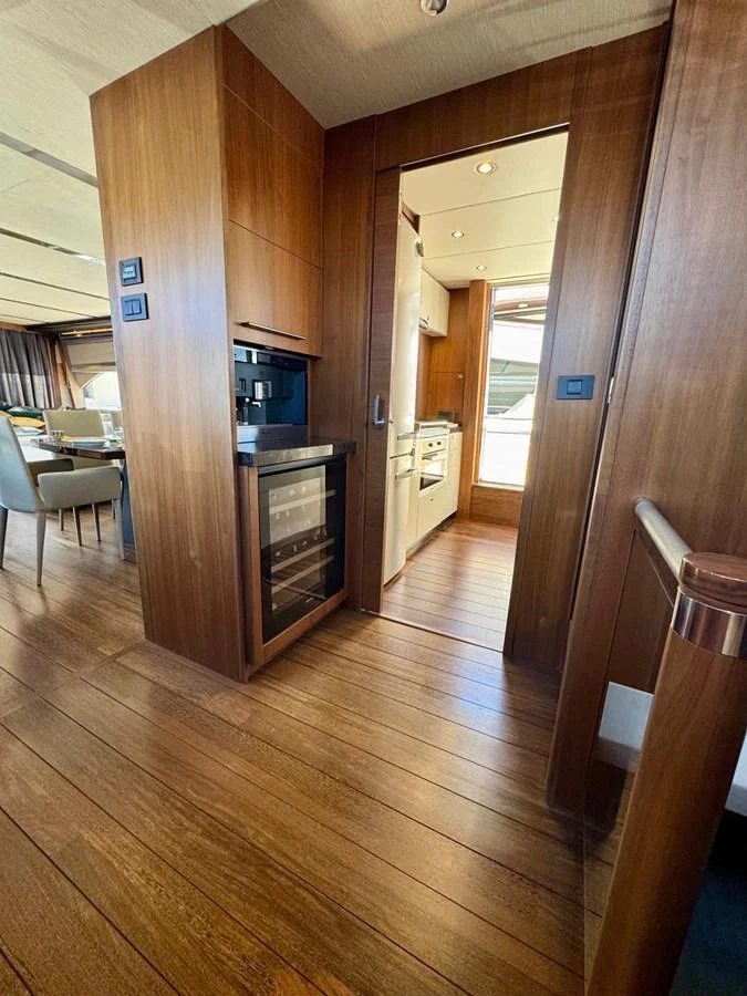 The yacht's galley features modern appliances and elegant wood finishes. aboard LADY N Yacht for Sale