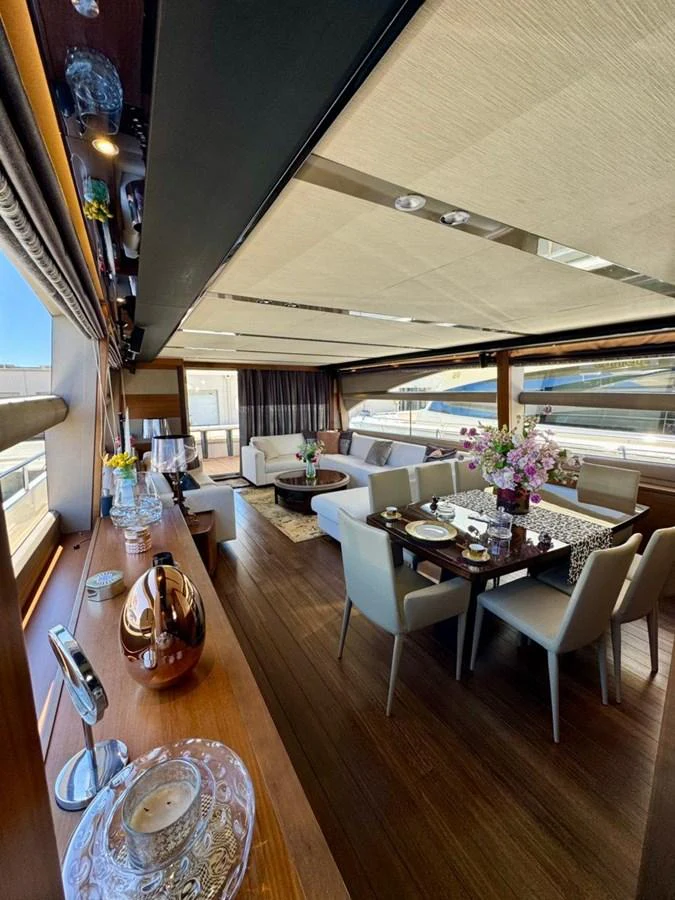 The yacht's salon features elegant dining and lounging areas with ample natural light. aboard LADY N Yacht for Sale