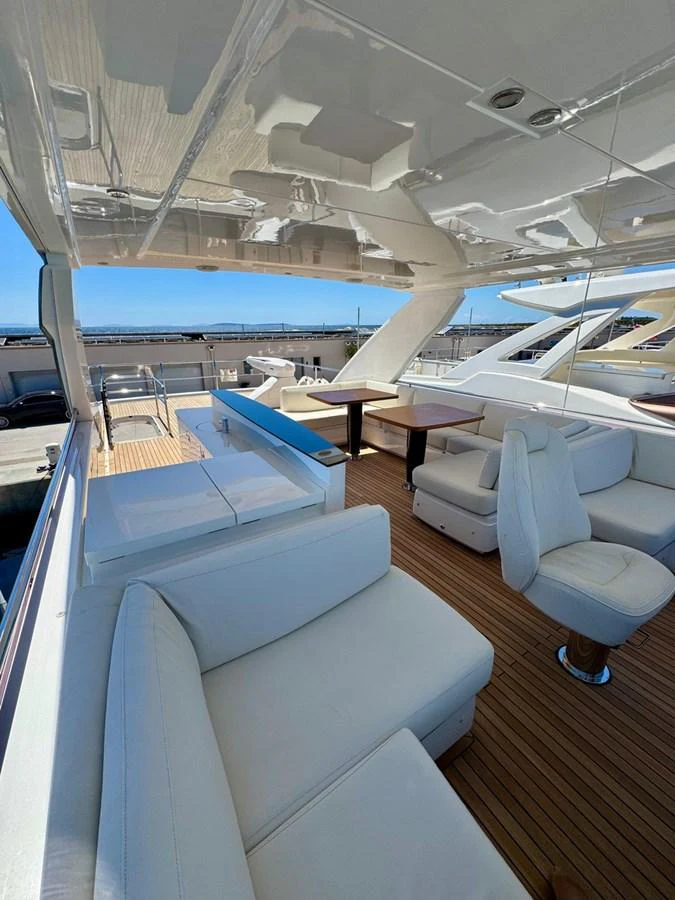 The flybridge offers a spacious and luxurious seating area with stunning views. aboard LADY N Yacht for Sale