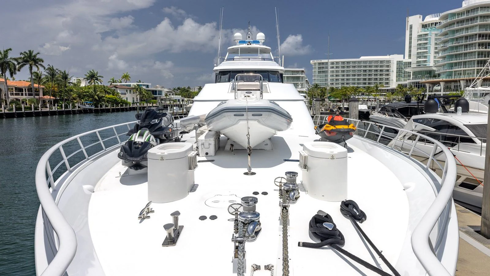 The foredeck of the yacht features ample space with water toys and equipment neatly arranged. aboard BAD COMPANY Yacht for Sale