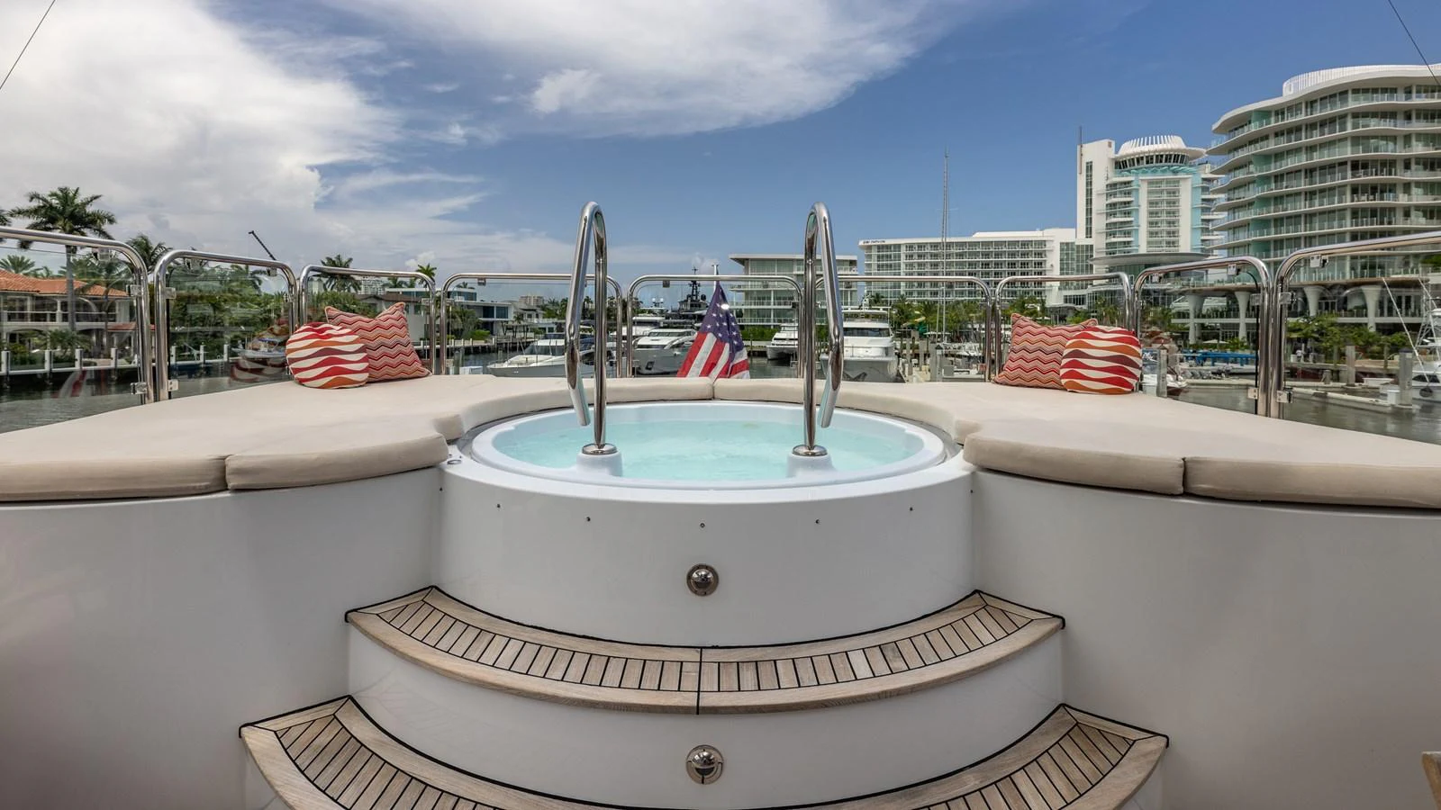 The yacht features a luxurious jacuzzi on the deck, perfect for relaxation with a view of the marina. aboard BAD COMPANY Yacht for Sale