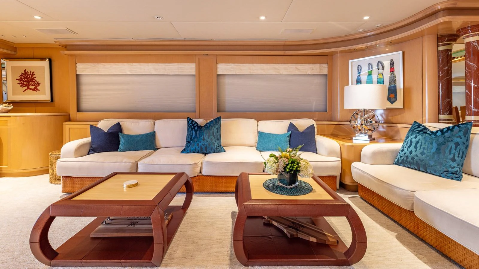 The salon features a spacious and elegant seating area with plush cushions and tasteful decor. aboard BAD COMPANY Yacht for Sale