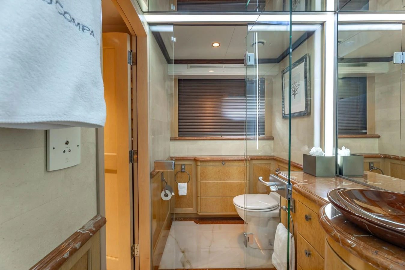 A luxurious bathroom with elegant fixtures and a glass-enclosed shower. aboard BAD COMPANY Yacht for Sale