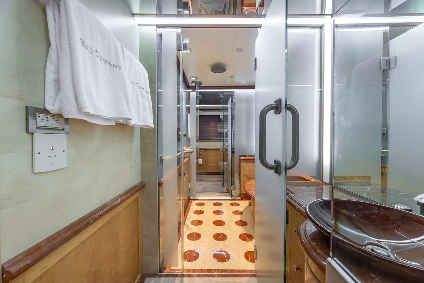 The yacht's bathroom features modern fixtures and a sleek design, providing a luxurious and comfortable space. aboard BAD COMPANY Yacht for Sale