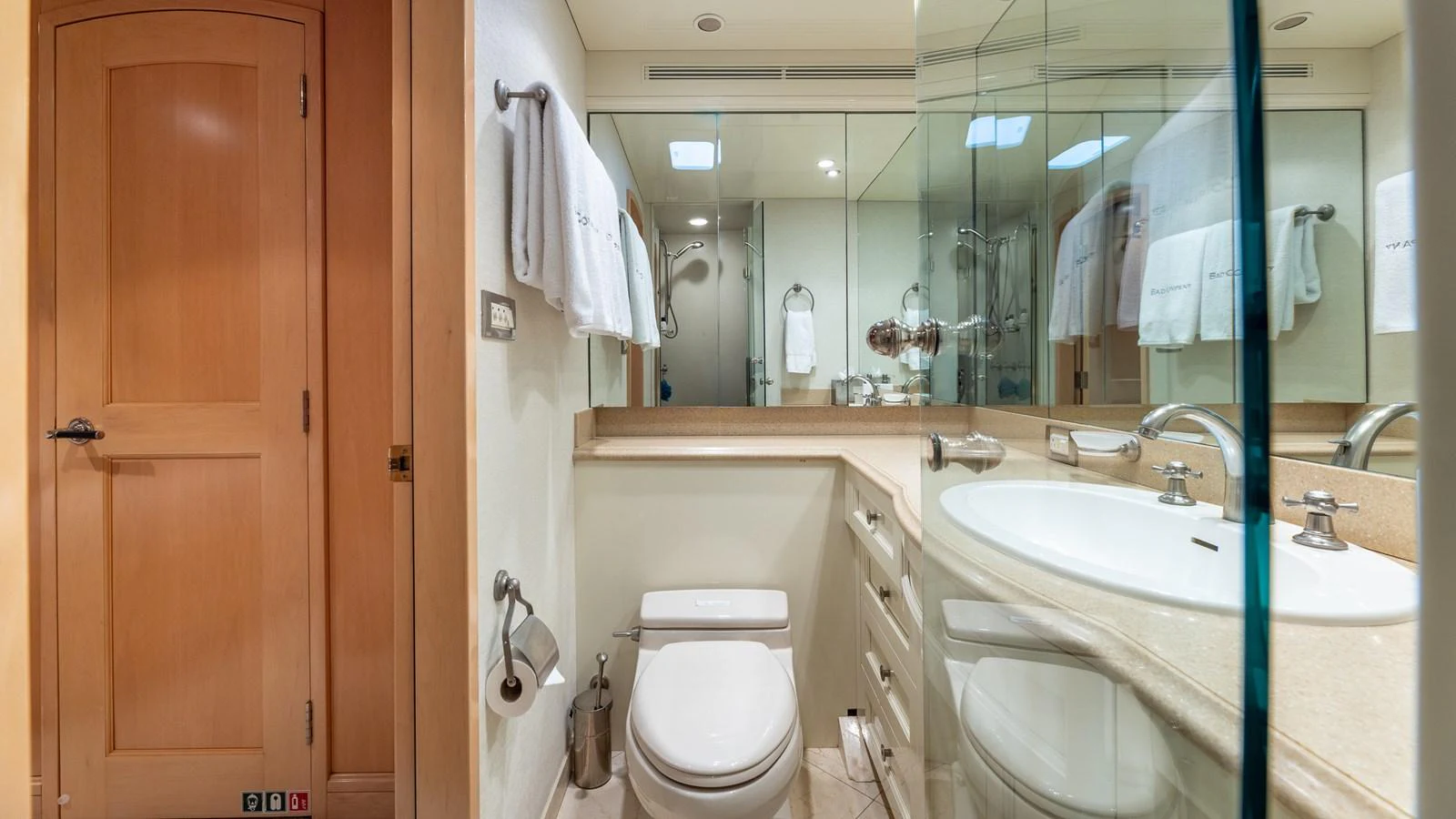 A well-appointed yacht bathroom featuring modern fixtures and ample lighting. aboard BAD COMPANY Yacht for Sale
