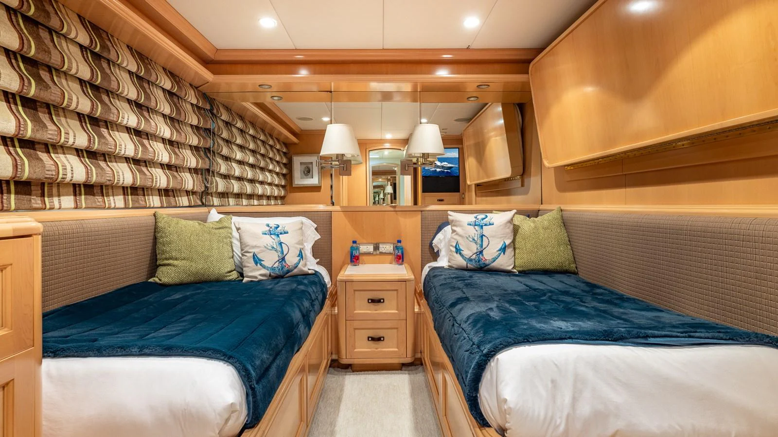 The twin stateroom features cozy beds with nautical-themed decor and ample lighting. aboard BAD COMPANY Yacht for Sale