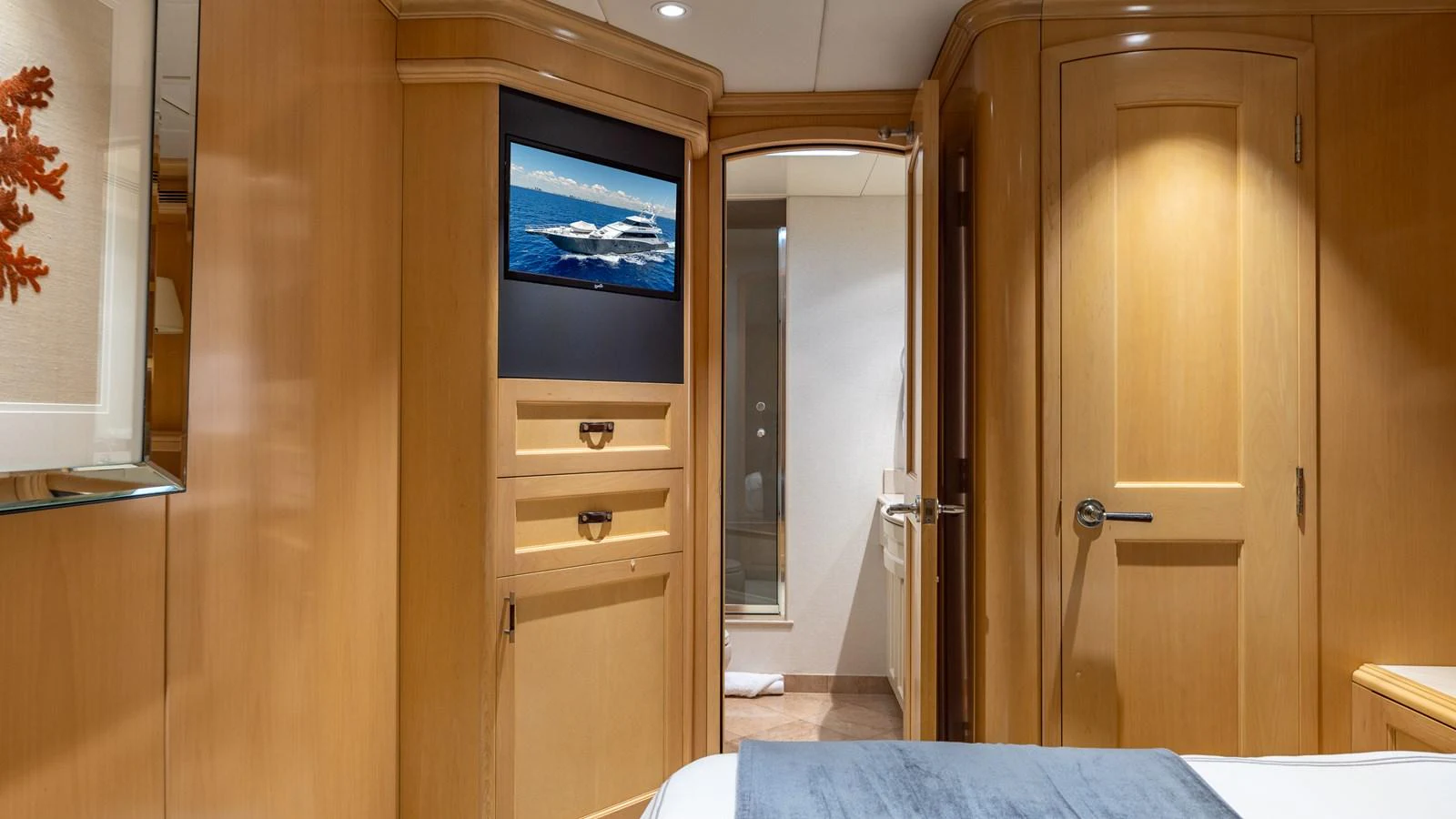 The yacht's interior features warm wood paneling and a cozy atmosphere. aboard BAD COMPANY Yacht for Sale
