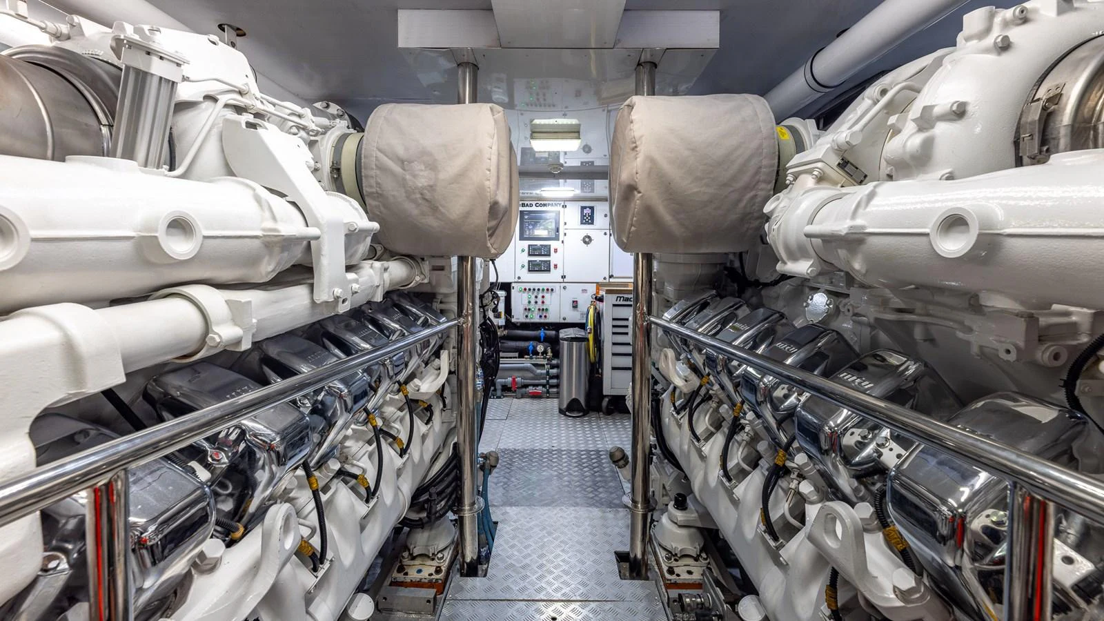 The image showcases a pristine engine room with well-maintained machinery and equipment. aboard BAD COMPANY Yacht for Sale