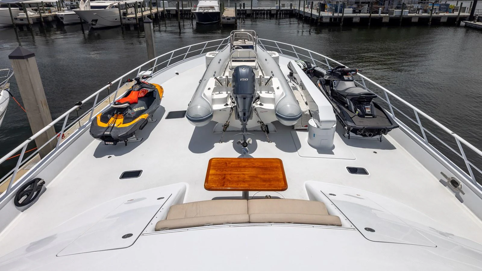 The foredeck features a well-equipped area with water toys and a tender, perfect for adventurous outings. aboard BAD COMPANY Yacht for Sale