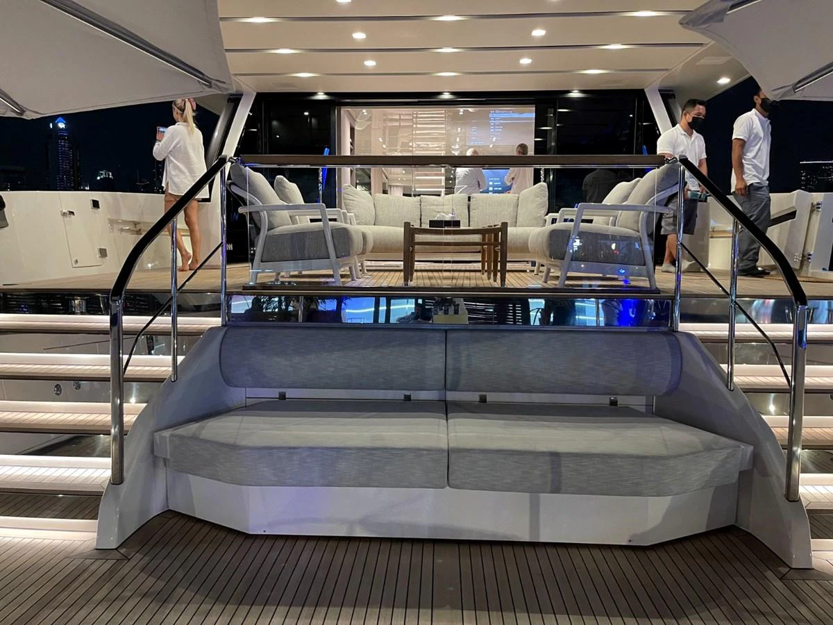 The aft deck features a spacious seating area with modern furnishings and ambient lighting, perfect for evening relaxation. aboard FOUZ Yacht for Sale