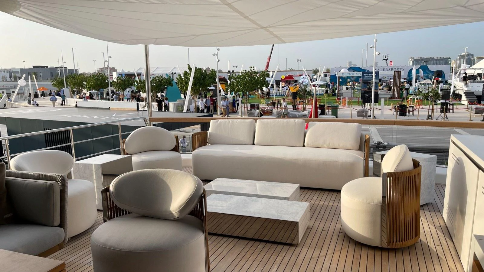The aft deck features a stylish and comfortable outdoor seating area with modern furniture and a shaded canopy. aboard FOUZ Yacht for Sale