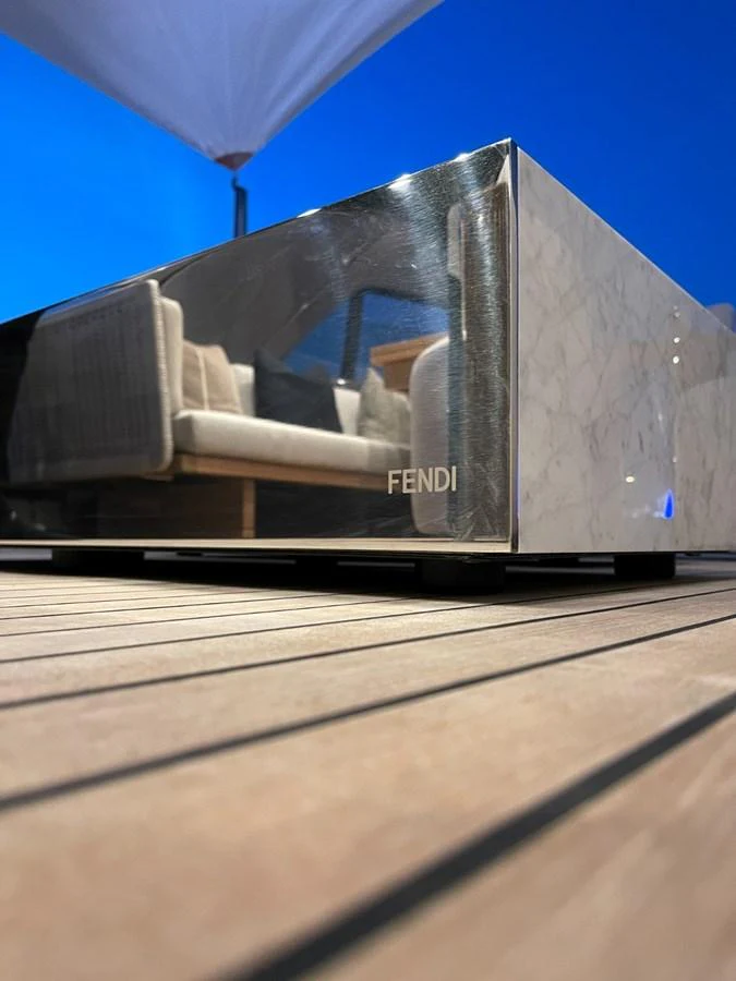 A close-up of a luxurious Fendi-branded furniture piece on the yacht's deck. aboard FOUZ Yacht for Sale