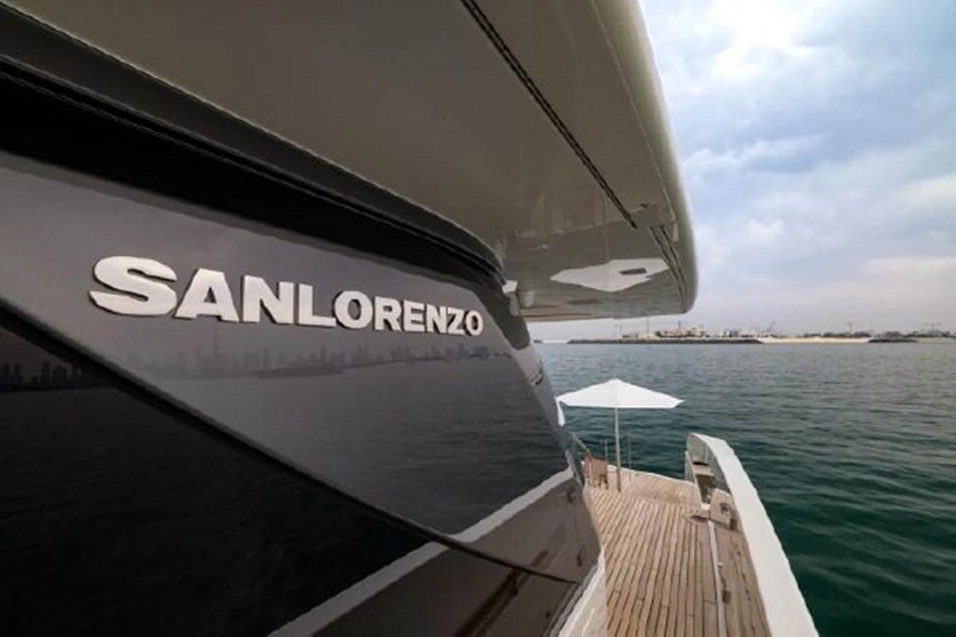 A sleek yacht exterior with a view of the deck and calm waters. aboard FOUZ Yacht for Sale
