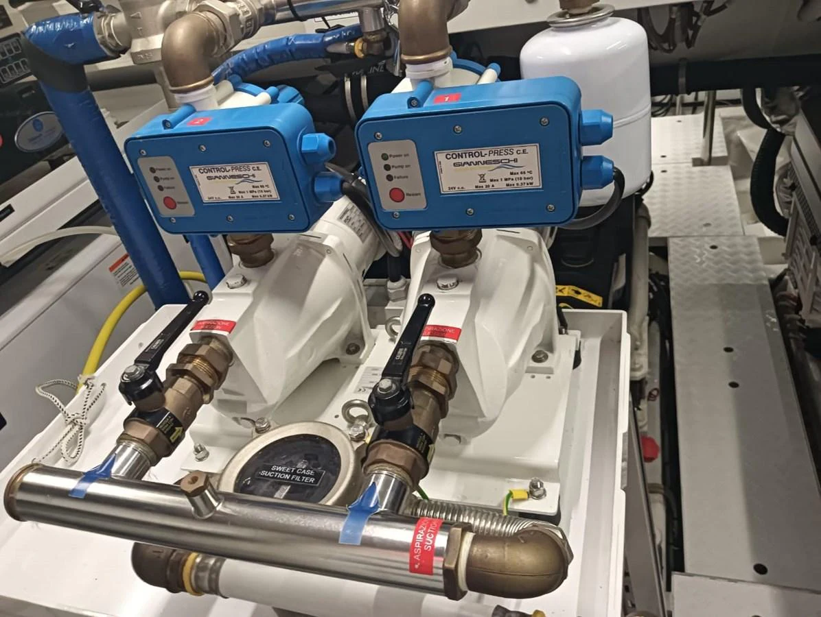 The image showcases a detailed view of the yacht's engine room with various mechanical components. aboard FOUZ Yacht for Sale