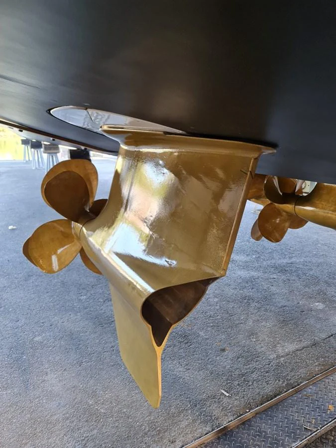 A close-up view of the yacht's propeller and rudder, showcasing its engineering and craftsmanship. aboard FOUZ Yacht for Sale