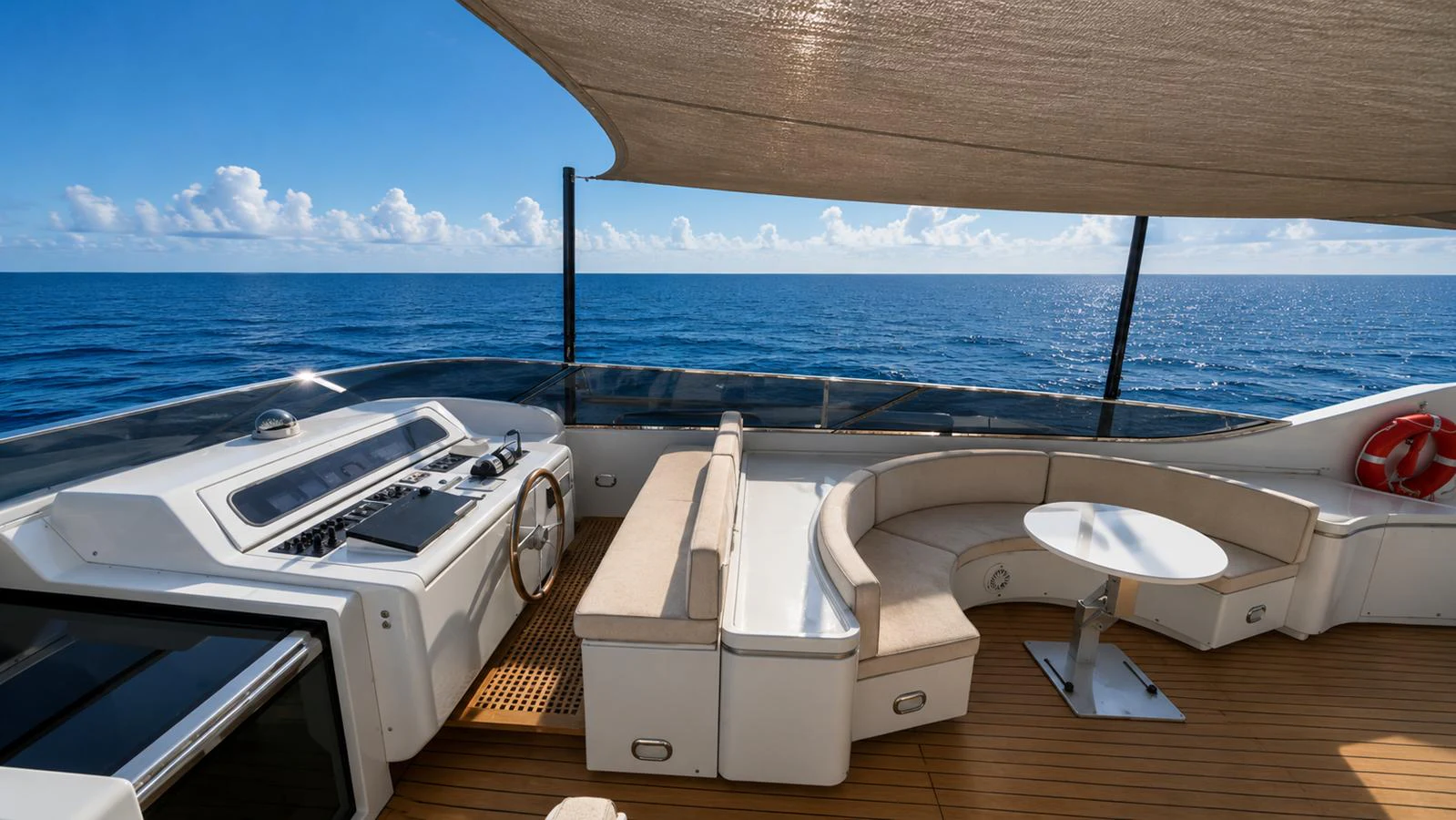 The flybridge offers a luxurious seating area with stunning ocean views. aboard ALPHERATZ Yacht for Sale