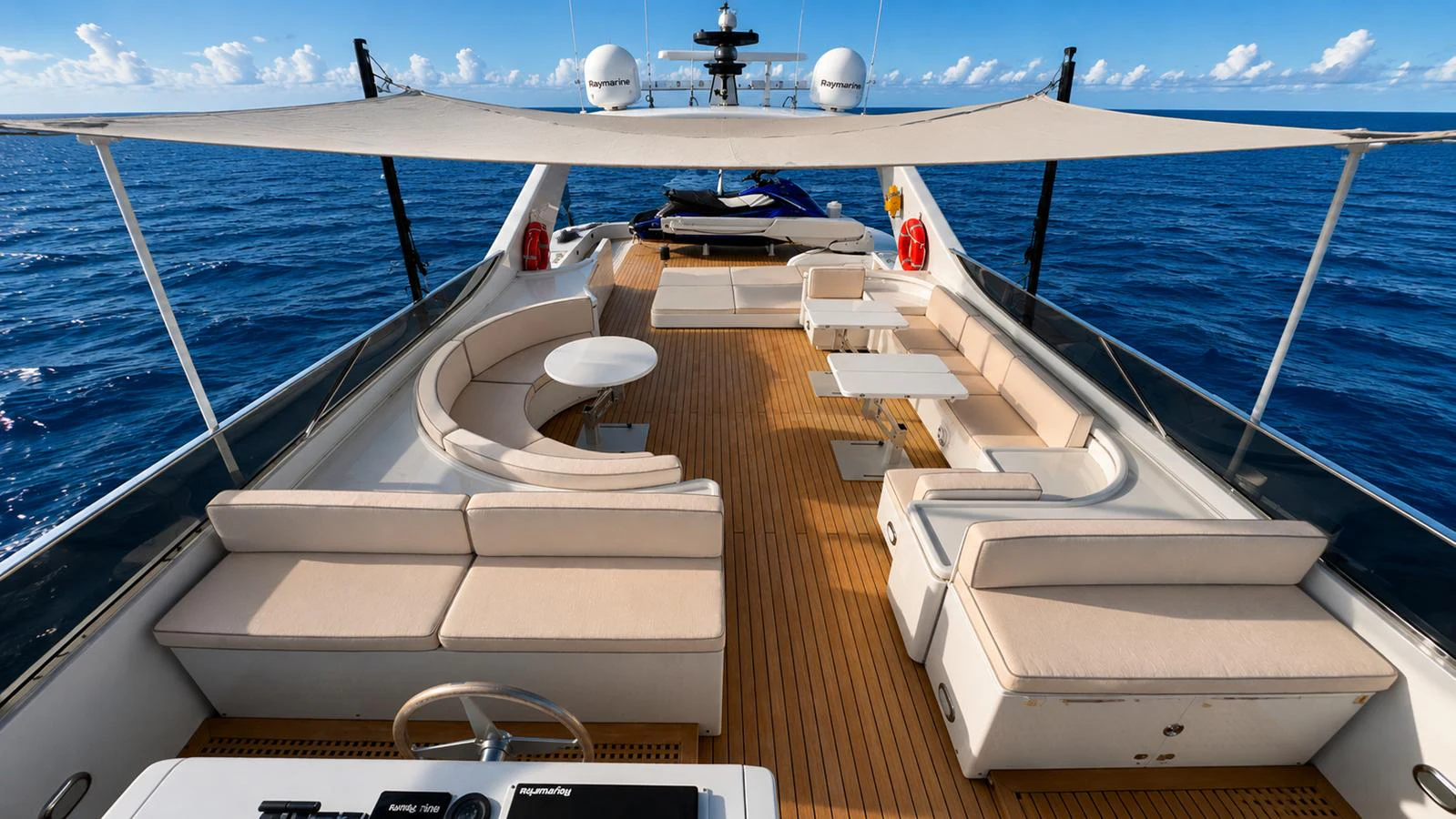 The yacht's sundeck offers ample seating and lounging areas under a shade canopy, perfect for relaxation and socializing. aboard ALPHERATZ Yacht for Sale