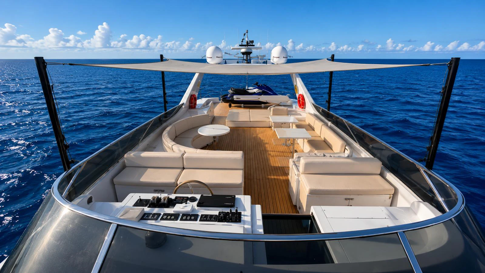 The flybridge offers spacious seating and stunning ocean views under a shaded canopy. aboard ALPHERATZ Yacht for Sale