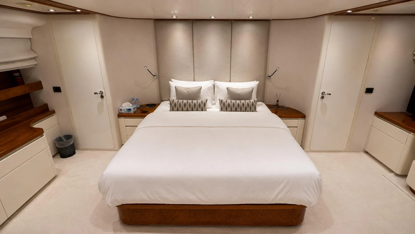 The master stateroom features a luxurious bed with elegant decor and ample storage. aboard ALPHERATZ Yacht for Sale