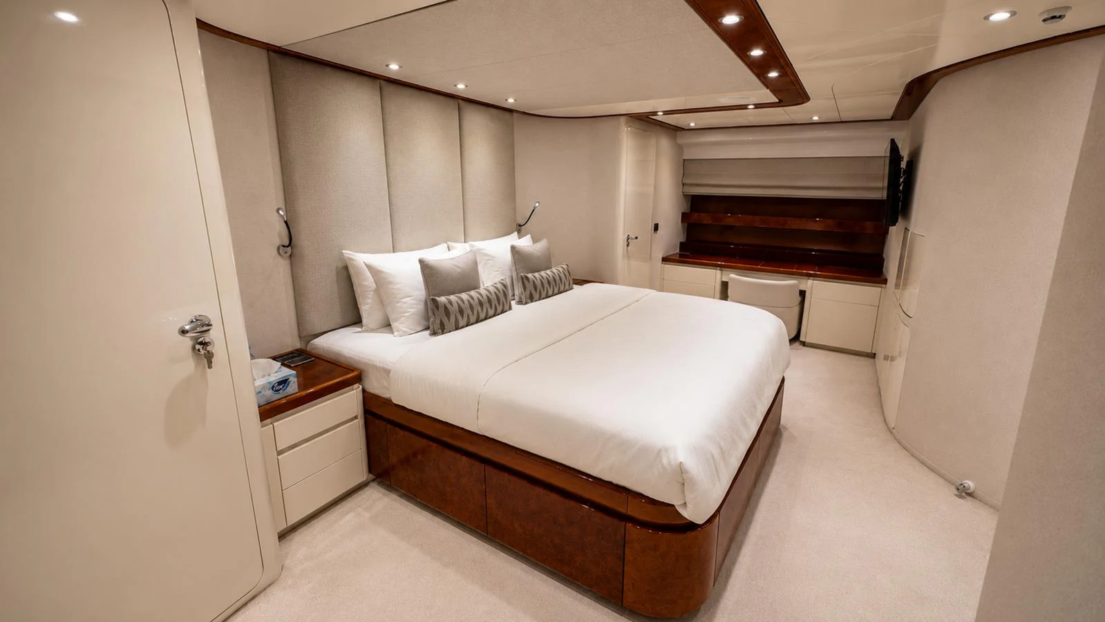 The master stateroom features a spacious bed with elegant decor and ample lighting. aboard ALPHERATZ Yacht for Sale