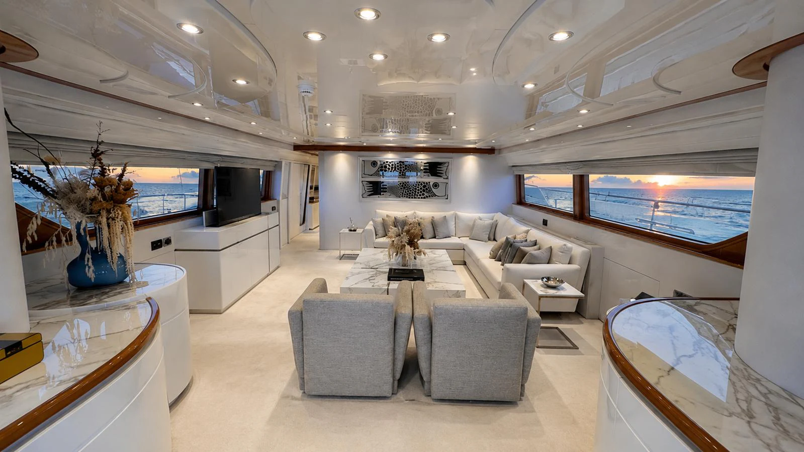The salon offers a spacious and luxurious seating area with panoramic ocean views. aboard ALPHERATZ Yacht for Sale