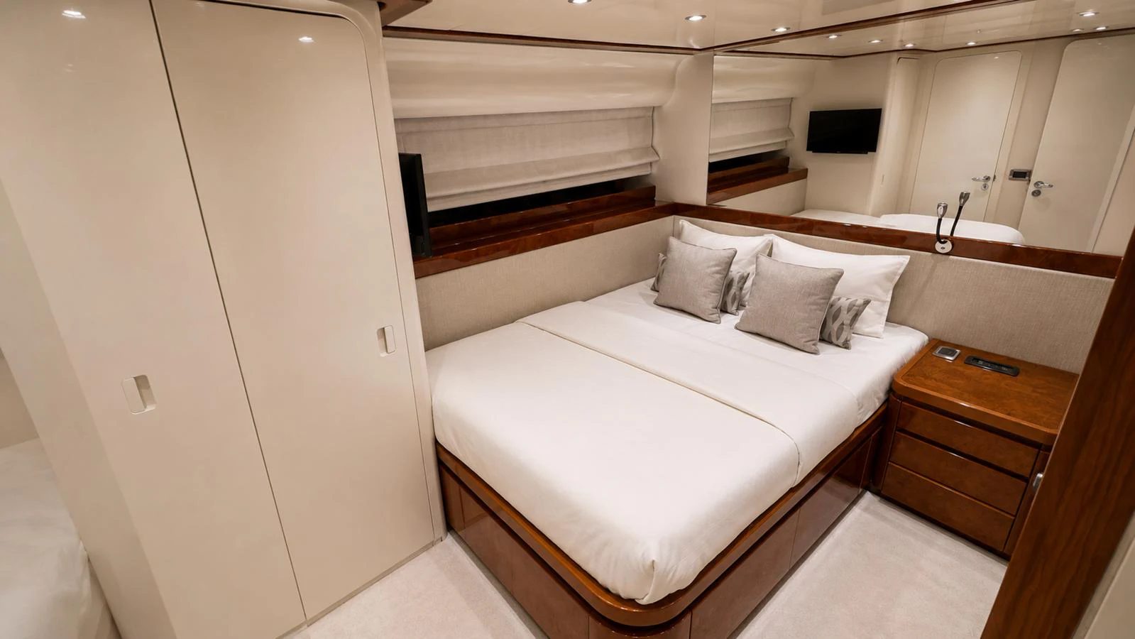 The stateroom features a luxurious double bed with elegant bedding and ample storage space. aboard ALPHERATZ Yacht for Sale